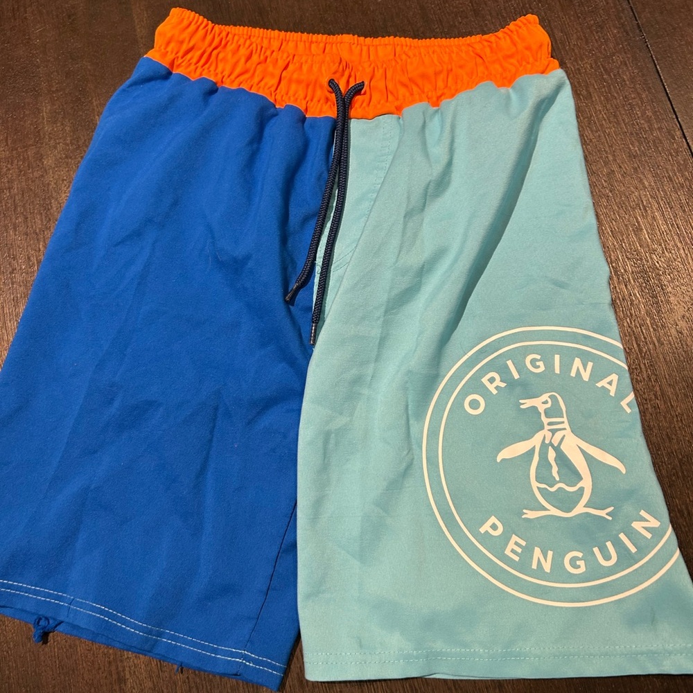 4 pair swim trunks and one swim shirt